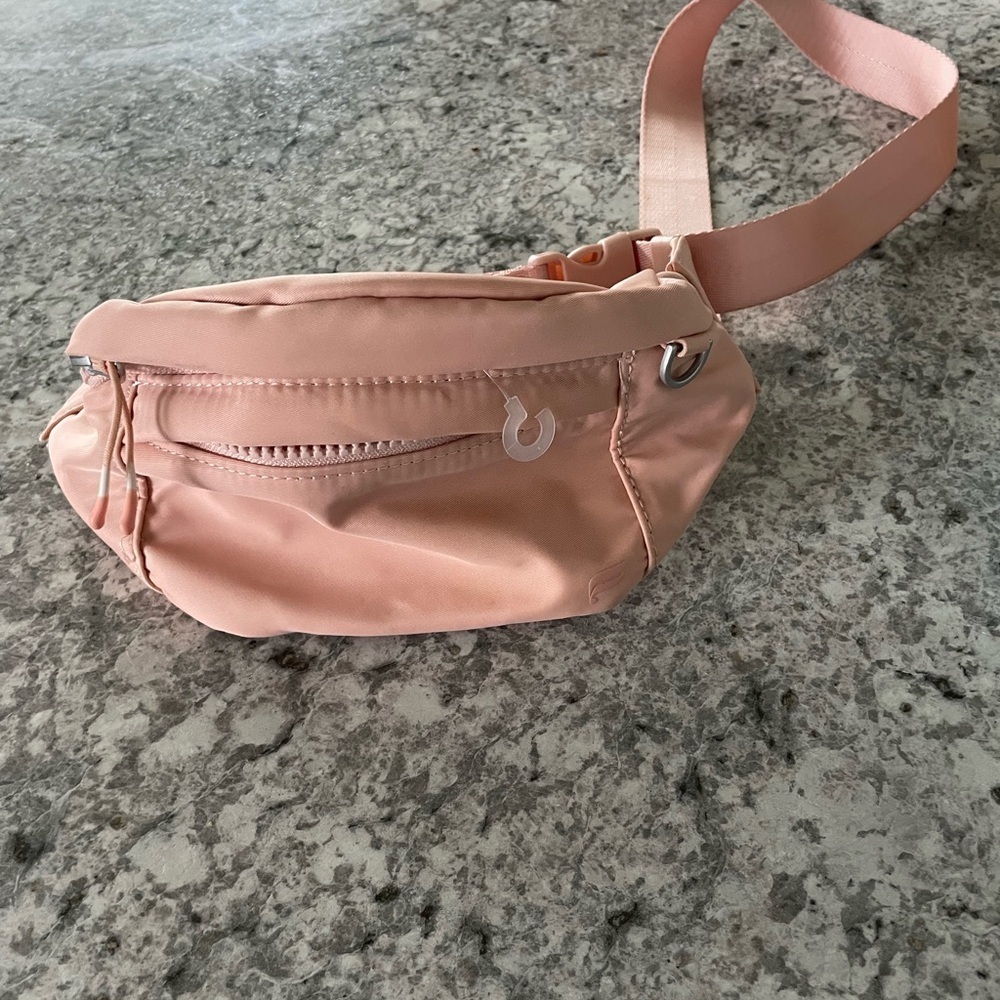 Fabletics Belt Bag color is peach new no tags